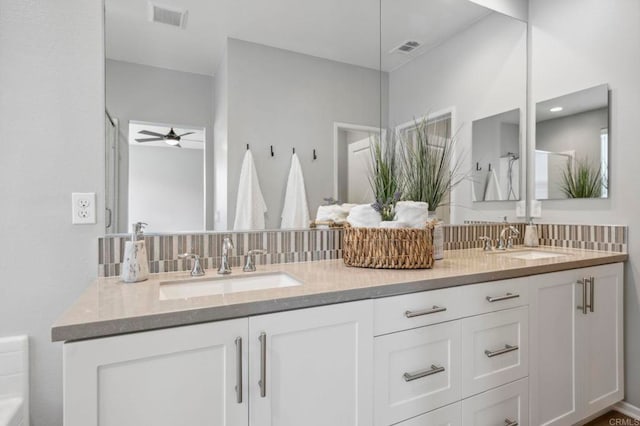 full bathroom with ceiling fan, a sink, and visible vents