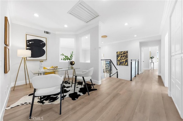 office space with crown molding, light wood-style floors, baseboards, visible vents, and recessed lighting