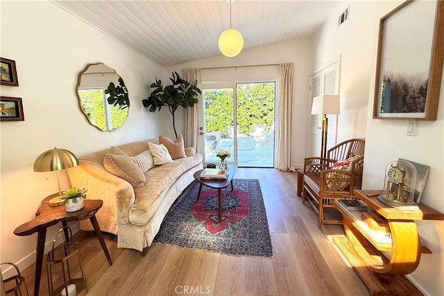 living room featuring visible vents, vaulted ceiling, wood finished floors, wooden ceiling, and baseboards