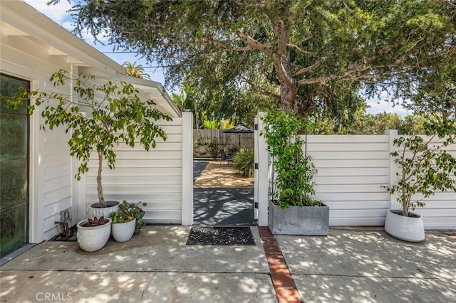 exterior space featuring a patio area and fence