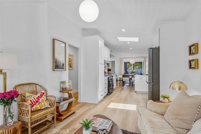 34832 Calle Del Sol, Dana Point, CA 92624 - living area featuring a skylight, light wood-type flooring, and recessed lighting