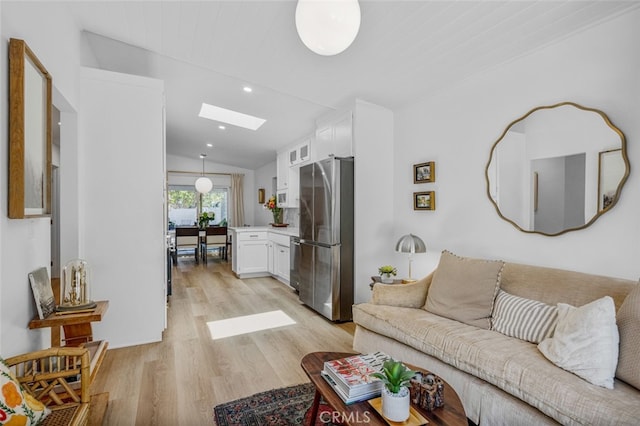 34832 Calle Del Sol, Dana Point, CA 92624 - living area featuring a skylight, lofted ceiling, light wood-style flooring, and recessed lighting