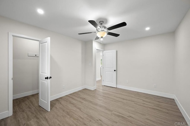 unfurnished bedroom featuring wood finished floors, ceiling fan, baseboards, and recessed lighting