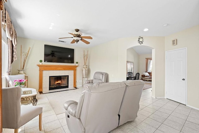 1396 Carneros Valley St, Chula Vista, CA 91913 - living room with arched walkways, light tile patterned floors, ceiling fan, a tile fireplace, and recessed lighting