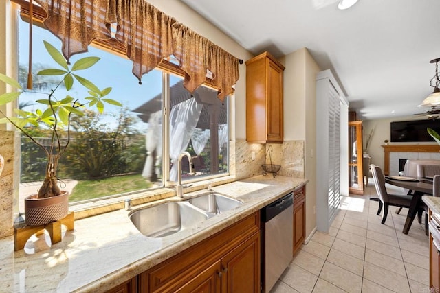 1396 Carneros Valley St, Chula Vista, CA 91913 - kitchen with a sink, dishwasher, light tile patterned floors, tasteful backsplash, and light stone counters