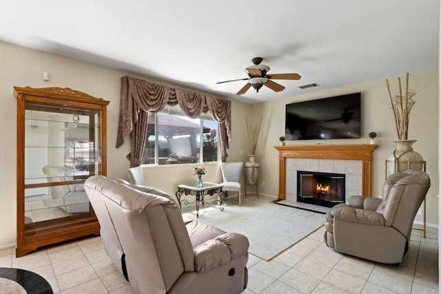1396 Carneros Valley St, Chula Vista, CA 91913 - living room with a ceiling fan, light tile patterned floors, a tile fireplace, and baseboards