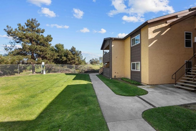 view of yard featuring a patio and a fenced backyard