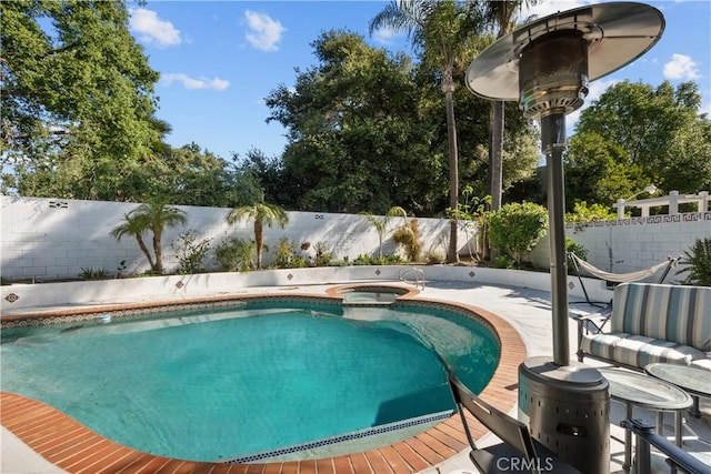 22041 Kinzie St, Chatsworth, CA 91311 - view of swimming pool featuring a fenced backyard and an in-ground hot tub