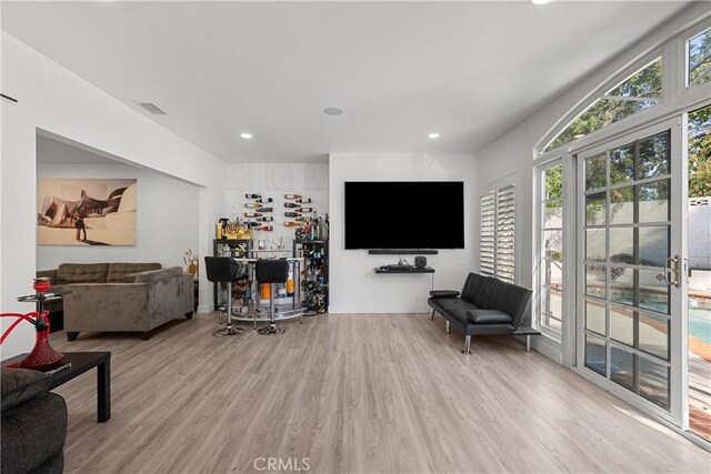 22041 Kinzie St, Chatsworth, CA 91311 - living area with wood finished floors, recessed lighting, and a dry bar