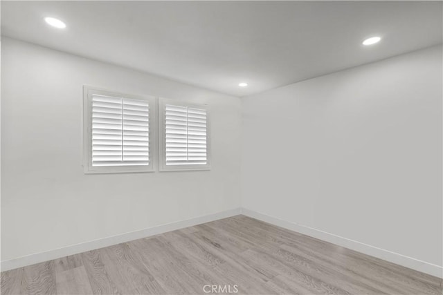 22041 Kinzie St, Chatsworth, CA 91311 - spare room featuring light wood-type flooring, baseboards, and recessed lighting