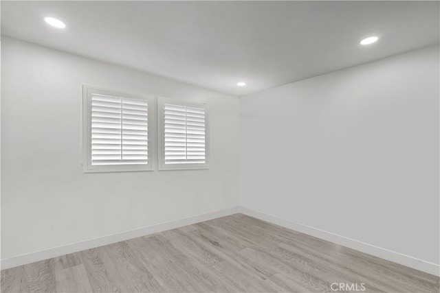 22041 Kinzie St, Chatsworth, CA 91311 - spare room featuring light wood-type flooring and recessed lighting