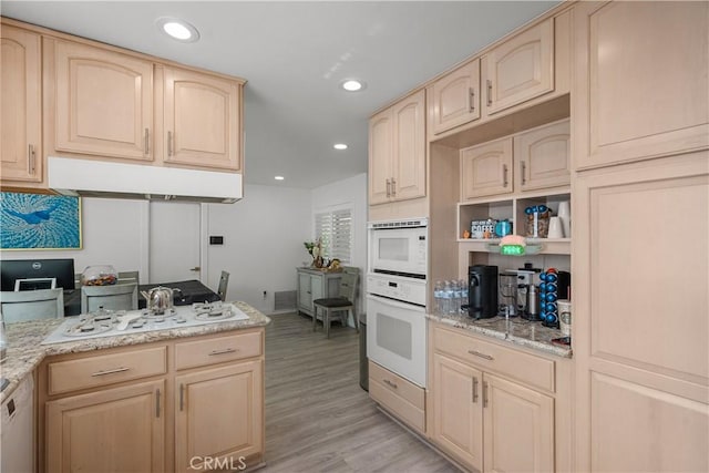 22041 Kinzie St, Chatsworth, CA 91311 - kitchen featuring light brown cabinetry, white appliances, light wood-style flooring, light stone counters, and recessed lighting