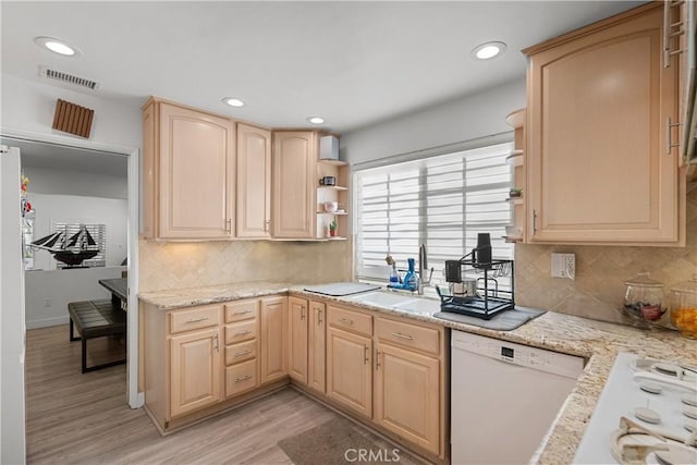 kitchen with white appliances, open shelves, visible vents, a sink, and light brown cabinetry