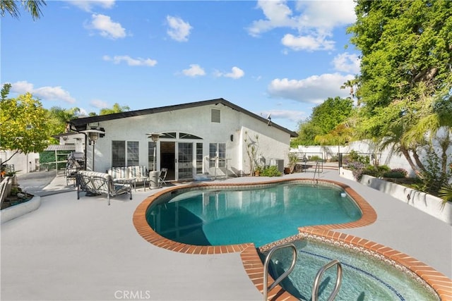 22041 Kinzie St, Chatsworth, CA 91311 - view of swimming pool with a patio area, french doors, and a pool with connected hot tub