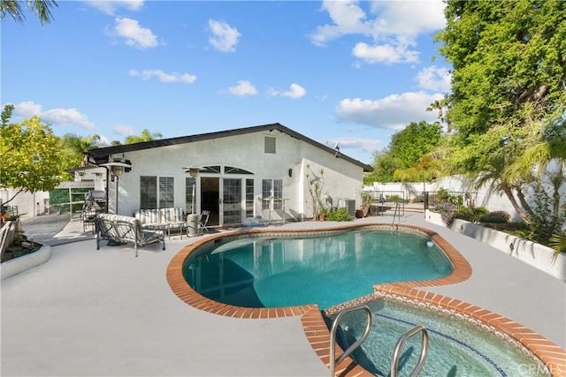 22041 Kinzie St, Chatsworth, CA 91311 - view of swimming pool with a patio, french doors, and a pool with connected hot tub