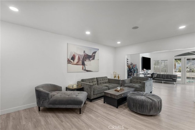 22041 Kinzie St, Chatsworth, CA 91311 - living area featuring light wood-style flooring and recessed lighting