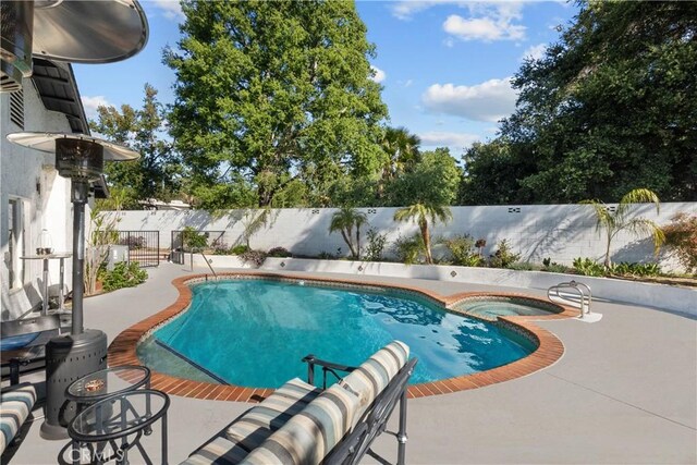 22041 Kinzie St, Chatsworth, CA 91311 - view of swimming pool with a fenced backyard, a patio, and a pool with connected hot tub