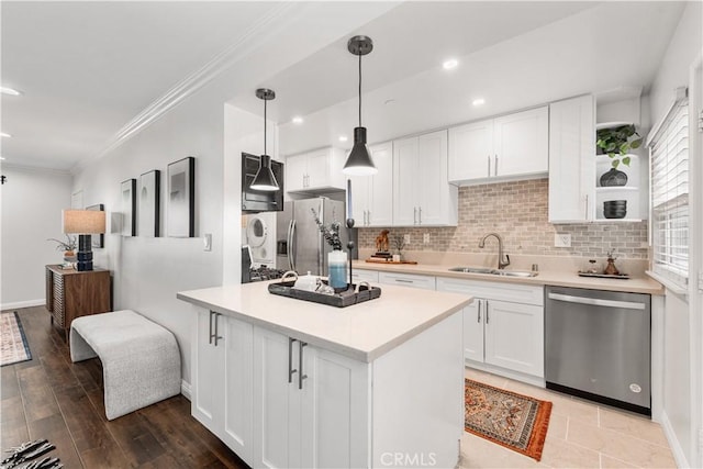 3614 Kalsman Dr Unit 1, Los Angeles, CA 90016 - kitchen with a sink, decorative backsplash, appliances with stainless steel finishes, and white cabinetry