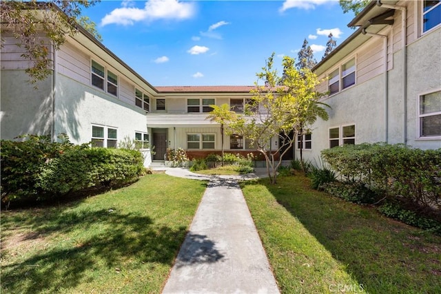 3614 Kalsman Dr Unit 1, Los Angeles, CA 90016 - exterior space featuring a front lawn and stucco siding
