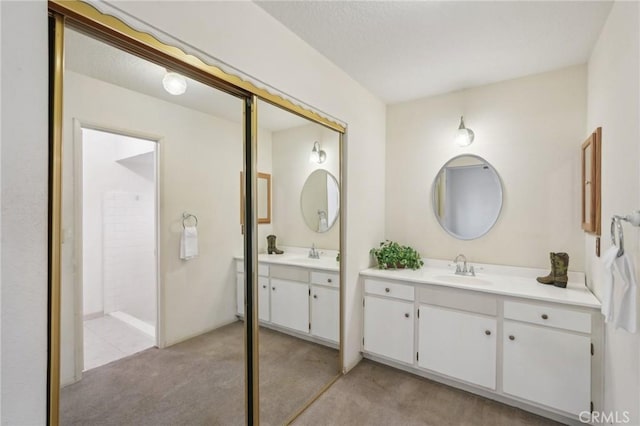 bathroom featuring two vanities and a sink