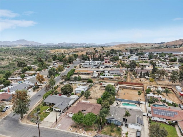 drone / aerial view featuring a residential view and a mountain view