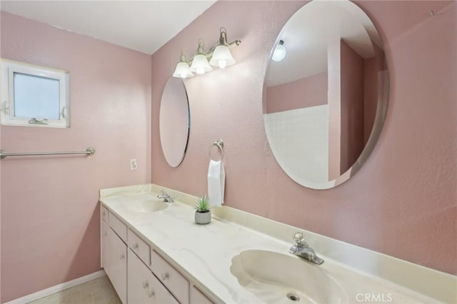 bathroom featuring double vanity and a sink