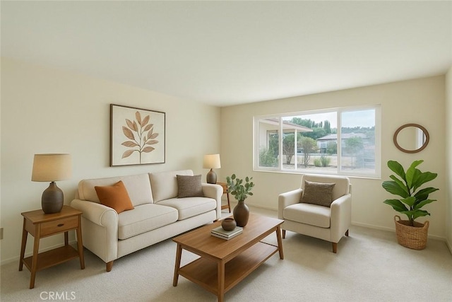 living room featuring light colored carpet and baseboards