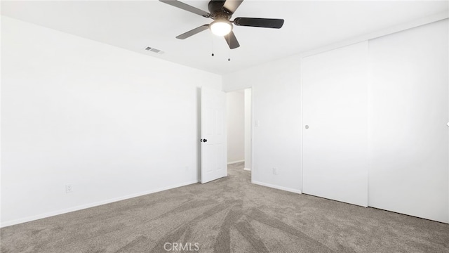 16722 Pauhaska Rd, Apple Valley, CA 92307 - unfurnished bedroom featuring carpet flooring, visible vents, baseboards, a closet, and a ceiling fan