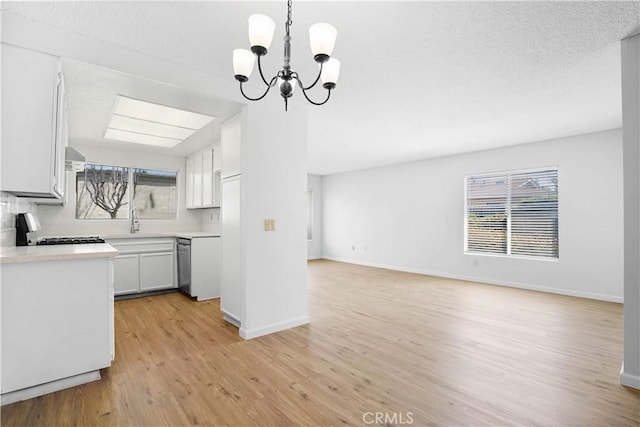 612 S Santa Fe St Unit 4, Hemet, CA 92543 - kitchen with open floor plan, light wood-type flooring, stove, and a healthy amount of sunlight