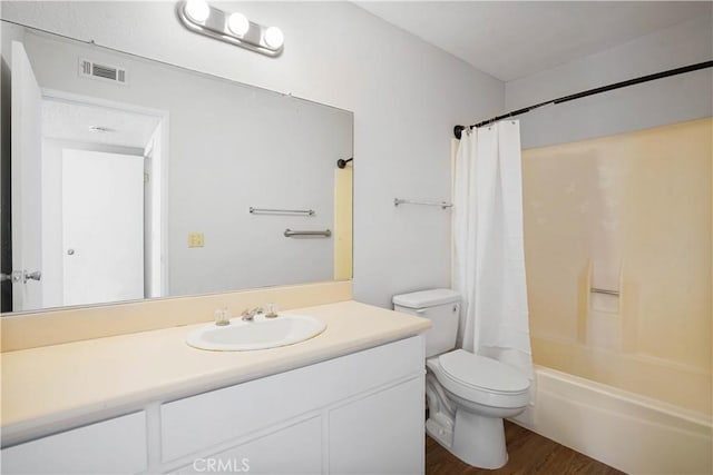 612 S Santa Fe St Unit 4, Hemet, CA 92543 - bathroom featuring vanity, visible vents, toilet, wood finished floors, and shower / tub combo