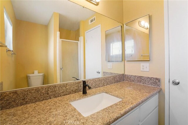 612 S Santa Fe St Unit 4, Hemet, CA 92543 - bathroom featuring visible vents, toilet, a stall shower, and a healthy amount of sunlight