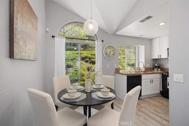 105 Whippoorwill Ln, Aliso Viejo, CA 92656 - dining space with visible vents, vaulted ceiling, and light wood-style flooring
