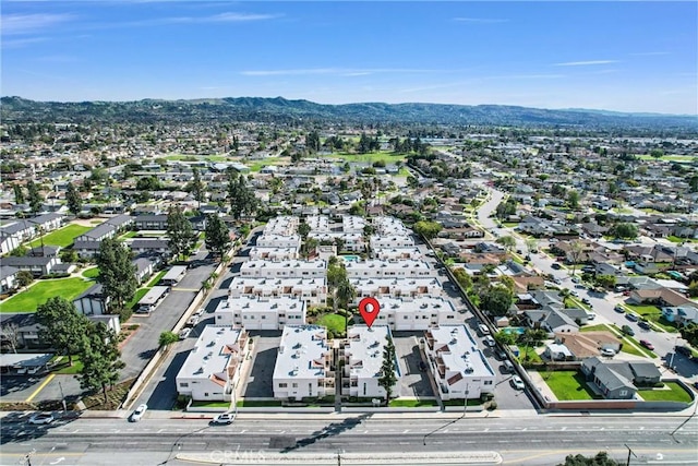 birds eye view of property featuring a mountain view and a residential view
