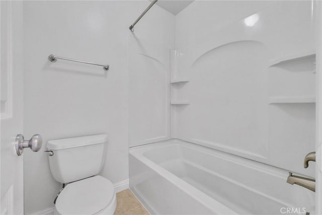 bathroom featuring toilet, tile patterned floors, shower / tub combination, and baseboards