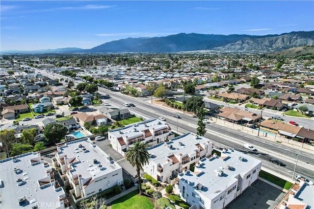 birds eye view of property with a mountain view and a residential view