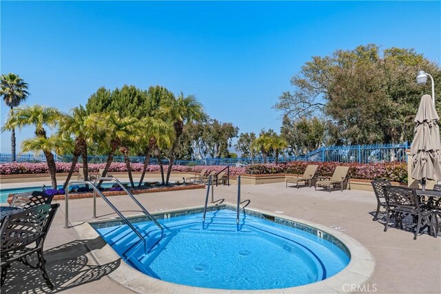 10 Cavalier, Laguna Niguel, CA 92677 - view of pool featuring a patio, a hot tub, and a pool