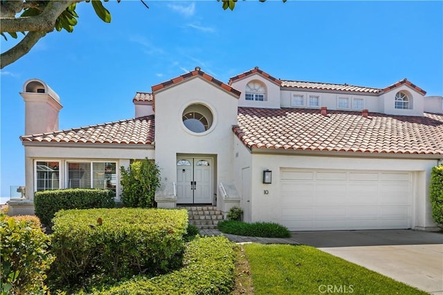 10 Cavalier, Laguna Niguel, CA 92677 - mediterranean / spanish-style house with stucco siding, a tiled roof, driveway, and a chimney