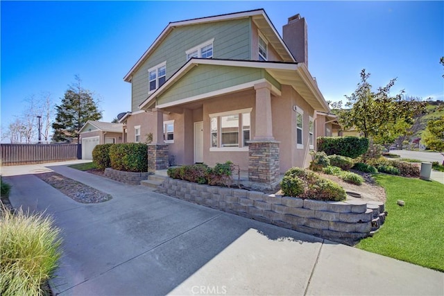 1961 Devaul Ranch Dr, San Luis Obispo, CA 93405 - view of front of property featuring a chimney, driveway, a garage, stucco siding, and stone siding