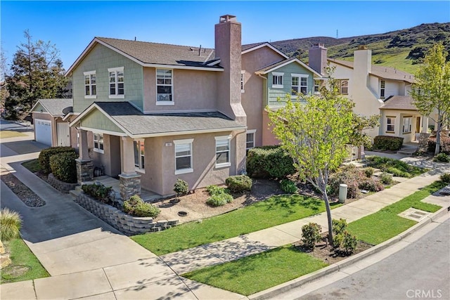 1961 Devaul Ranch Dr, San Luis Obispo, CA 93405 - traditional home featuring concrete driveway, a garage, stucco siding, a chimney, and a shingled roof