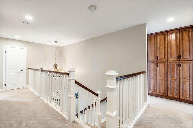 17851 Nearbank Dr, Rowland Heights, CA 91748 - hall with light carpet, baseboards, recessed lighting, and an upstairs landing