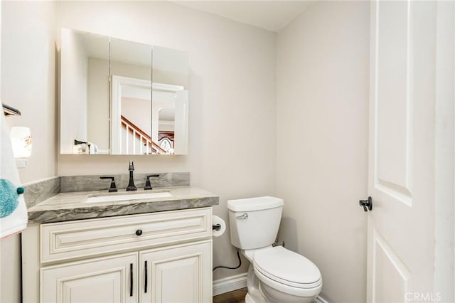 17851 Nearbank Dr, Rowland Heights, CA 91748 - half bath with baseboards, vanity, and toilet