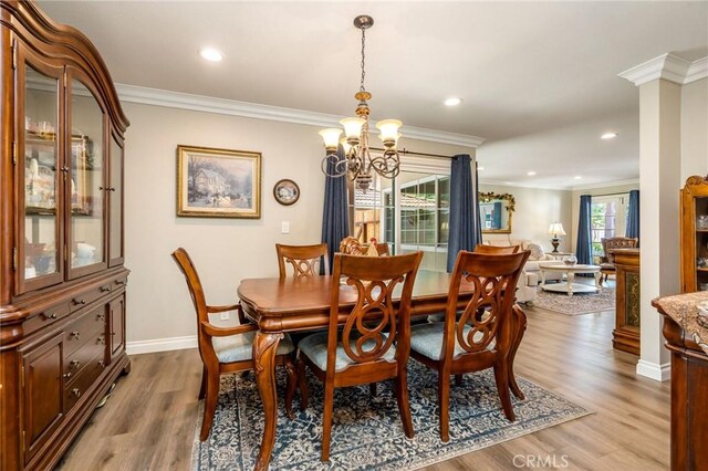 17851 Nearbank Dr, Rowland Heights, CA 91748 - dining room featuring ornamental molding, wood finished floors, and a chandelier