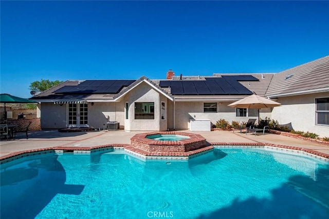 view of pool featuring a patio, french doors, a fenced in pool, and an in ground hot tub