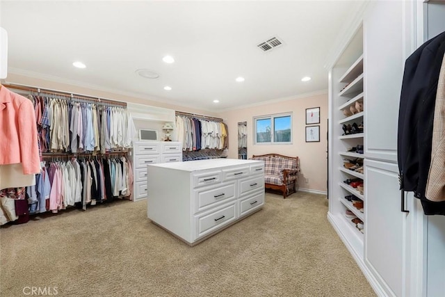 walk in closet featuring light carpet and visible vents