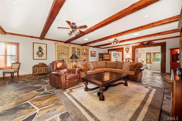 living area featuring ceiling fan, recessed lighting, plenty of natural light, and stone finish flooring