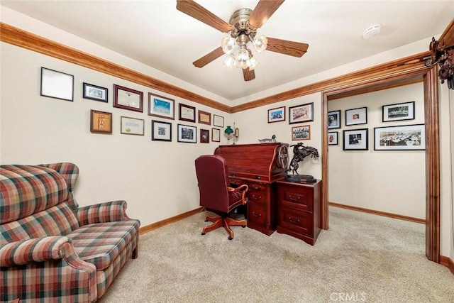 office featuring carpet, baseboards, and a ceiling fan