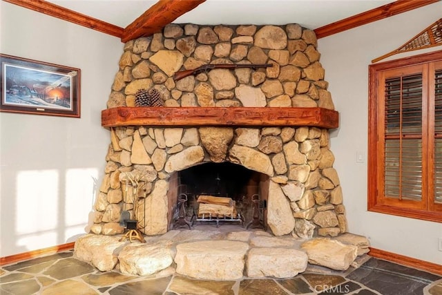 details with crown molding, baseboards, and a stone fireplace