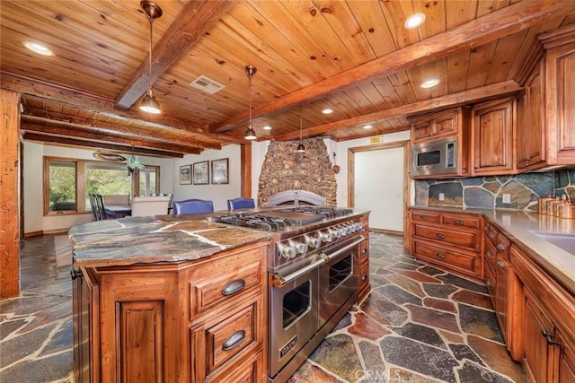 kitchen featuring visible vents, a kitchen island, stone flooring, wood ceiling, and stainless steel appliances