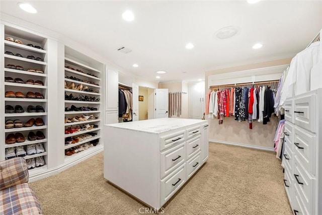 spacious closet with light colored carpet