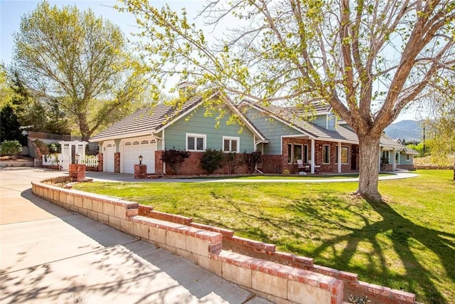 view of front of house with driveway, a front yard, a garage, and brick siding